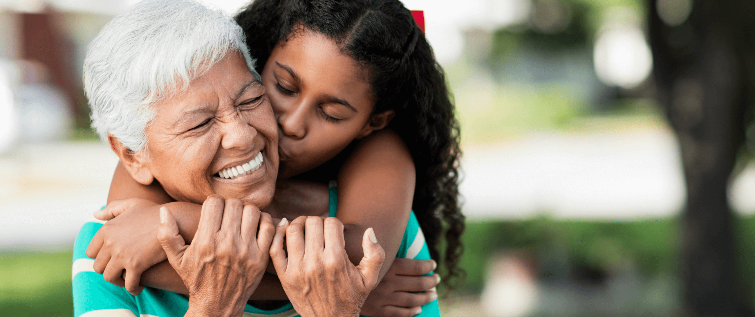 granddaughter hugging her grandma
