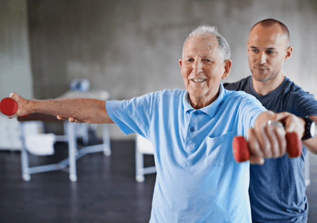 Senior man lifting hand weights