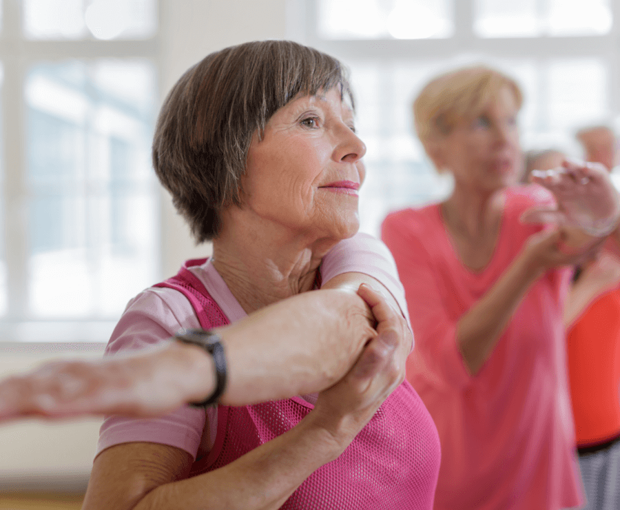 Senior women stretching